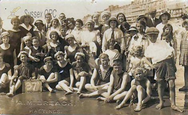 Image of Hastings - Holiday Makers on the Beach