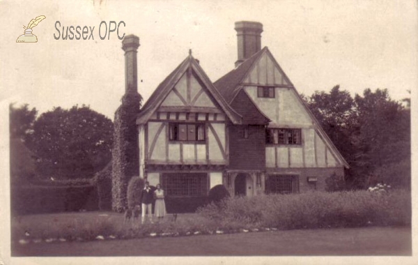 Aldwick - House with couple and dog posing outside