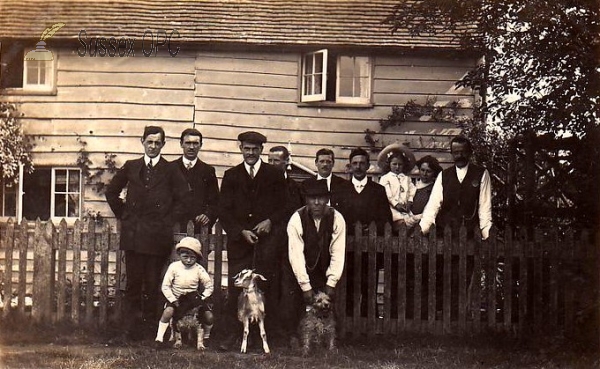 Image of Brooks Green - People outside of wooden house