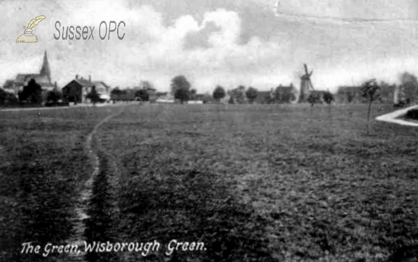 Wisborough Green - The Green showing St Peter ad Vincula Church and Windmill